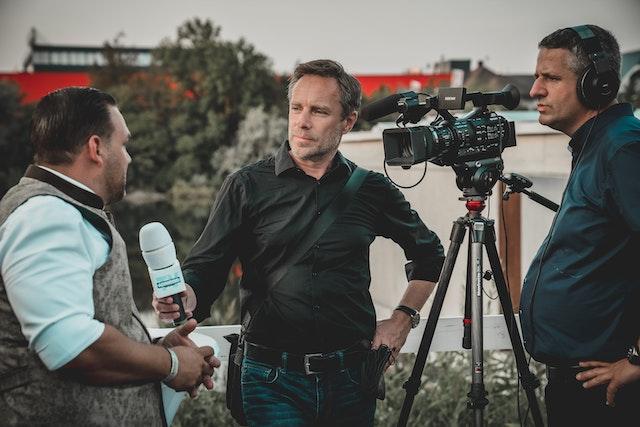 news reporter cameraman interview